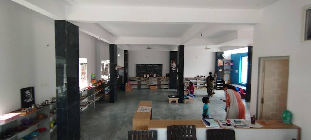 Children and guides moving through Chandrica Montessori's open learning space