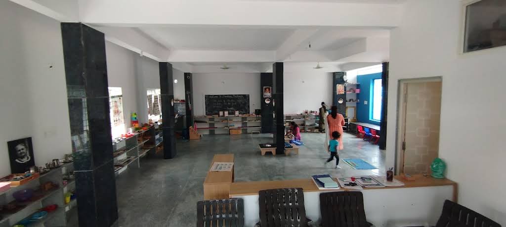 The open Chandrica Montessori classroom and its low material shelves